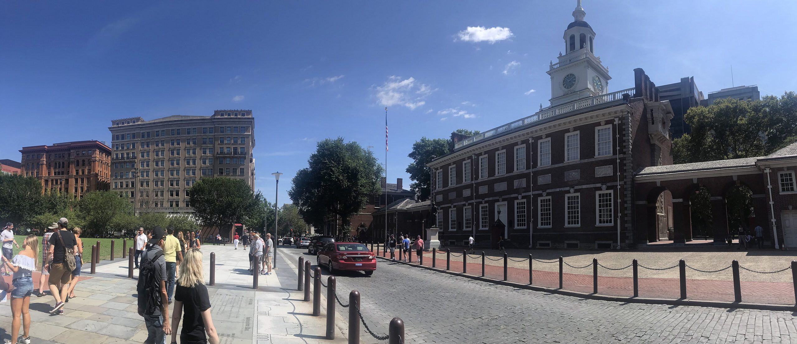 Independence Hall seen from Chestnut Street with visitors and cobblestones in Philadelphia's Historic District