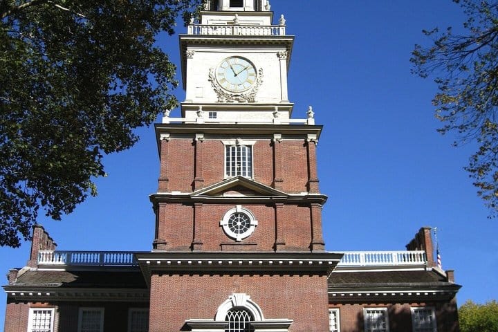 The Independence Hall bell tower against a blue sky